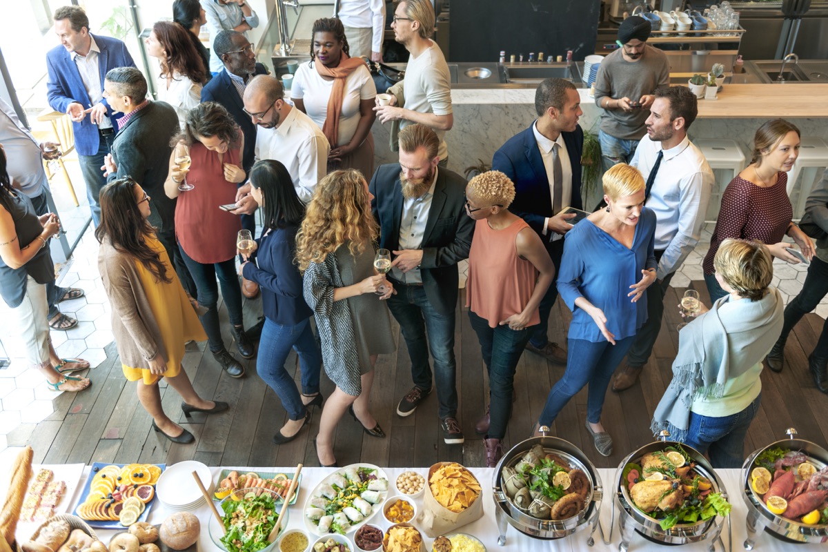 Colleagues gathering over drinks and appetizers